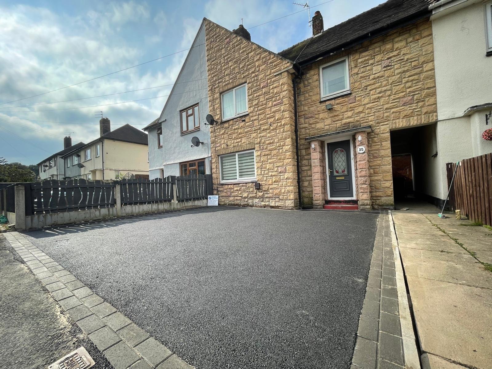 New driveway installation outside a home